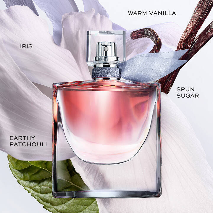 Perfume bottle with floral and vanilla elements on a white background
