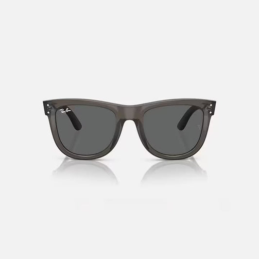 Gray sunglasses with a reflective surface on a white background