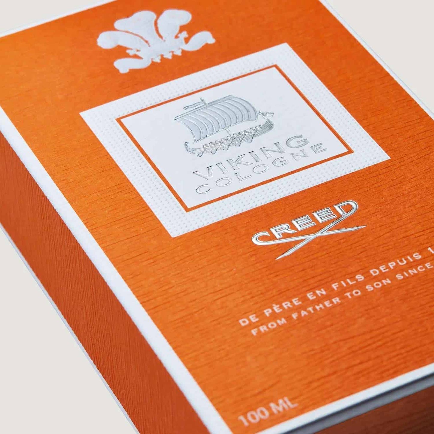 Orange box of Viking Cologne by Creed with white text and logo.