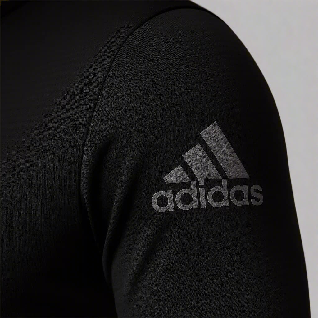 Black Adidas logo on a dark background
