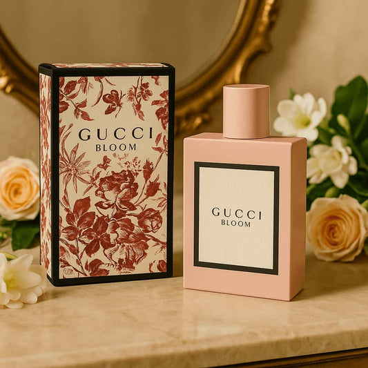 Gucci Bloom perfume bottle and packaging with floral design on a decorative surface.