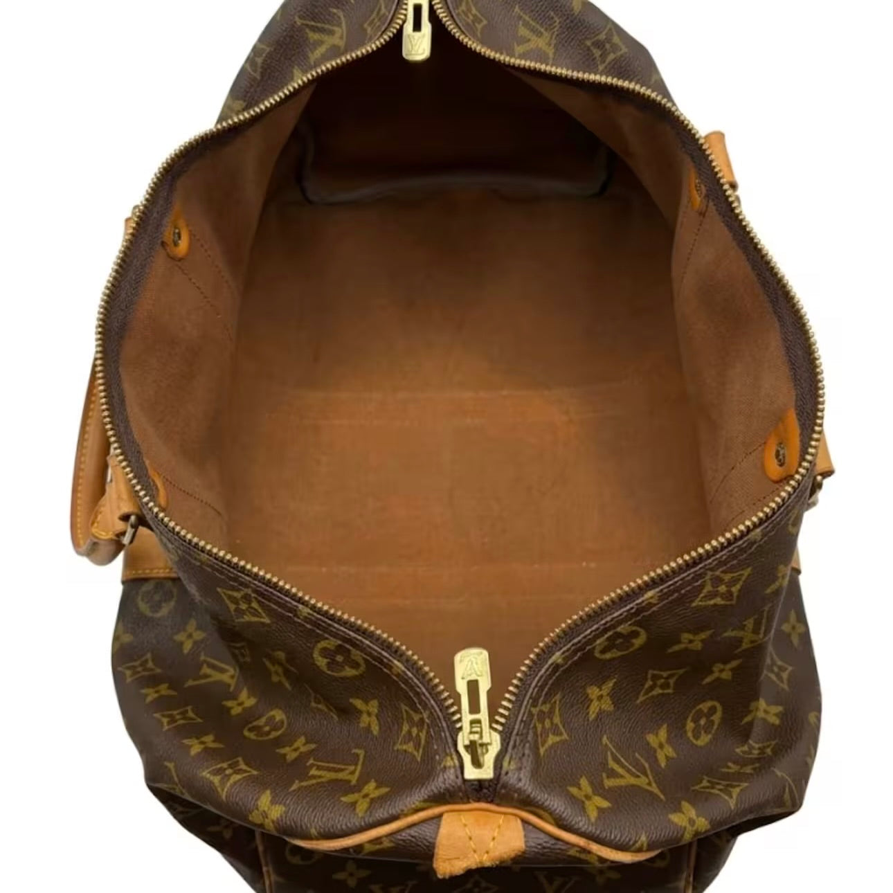 Interior view of a spacious Louis Vuitton monogram canvas travel duffle bag showing a clean, wide-open brown fabric-lined compartment and gold-tone zipper details.⁠
