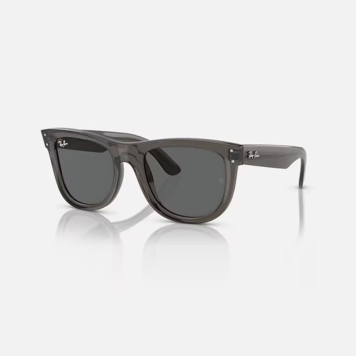Gray sunglasses with a reflective surface on a white background