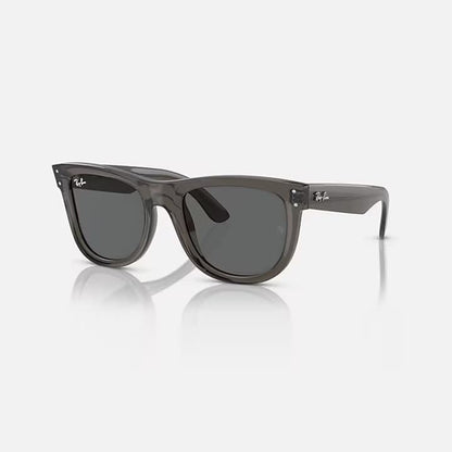 Gray sunglasses with a reflective surface on a white background
