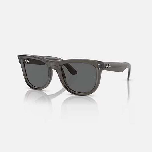 Gray sunglasses with a reflective surface on a white background
