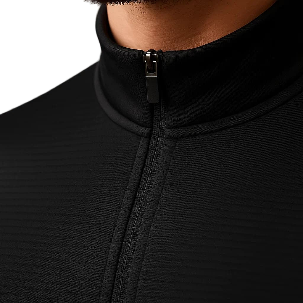 Close-up of a black zip-up hoodie with a neutral background
