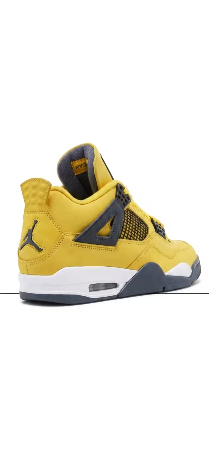 A rear three-quarter view of an Air Jordan 4 Retro 'Lightning' sneaker in yellow nubuck leather, with a black Jumpman logo on the heel. The shoe has white and grey midsoles and a visible Air unit. The upper features black mesh netting and grey lace wings. The interior is grey with a yellow tab labeled 'JORDAN'.
