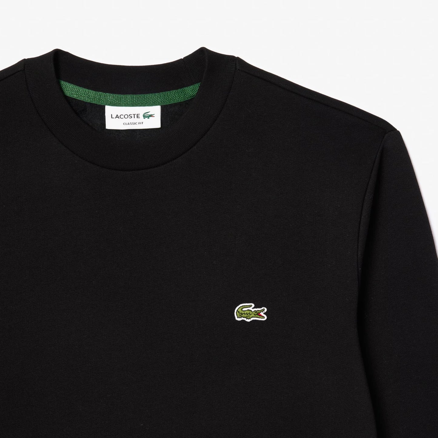 Black sweatshirt with Lacoste logo on a white background