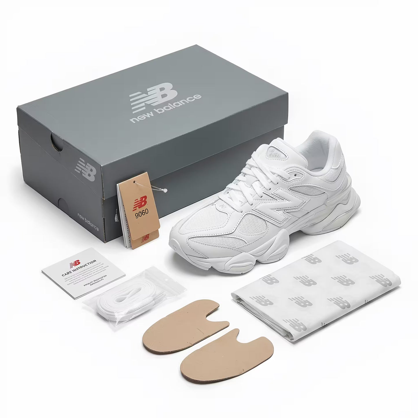 White new balance 9060 sneaker with New Balance packaging, shoe care items, and a card on a white background