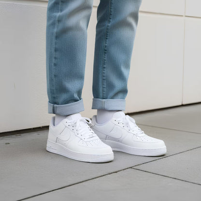Nike Air Force 1 White sneakers worn with light blue jeans on a neutral lifestyle street background