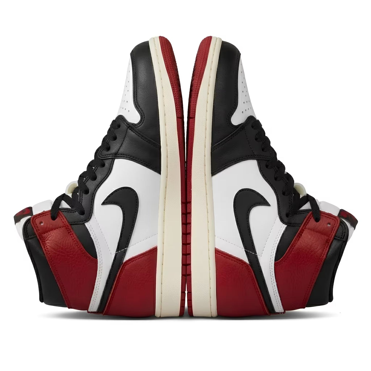 Black, red, and white Air Jordan sneakers with a nike tick logo on a white background