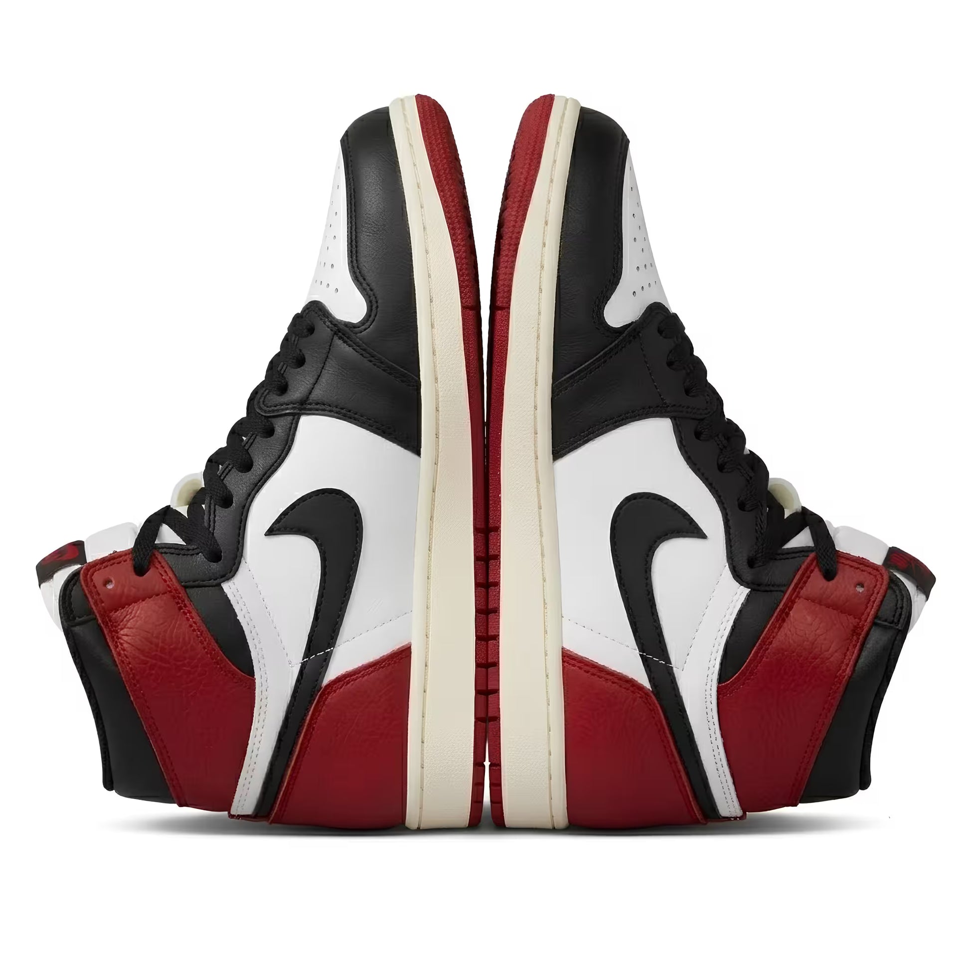 Black, red, and white Air Jordan sneakers with a nike tick logo on a white background