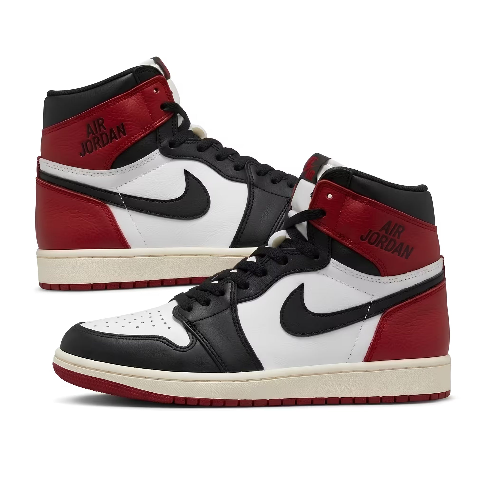 Red, black, and white sneakers with 'Air Jordan' branding on a white background