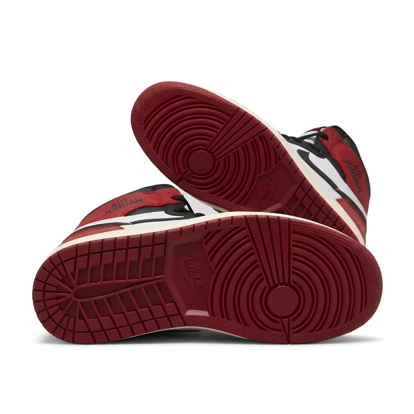 Red and black air jordan 1 sneaker with a white sole on a white background