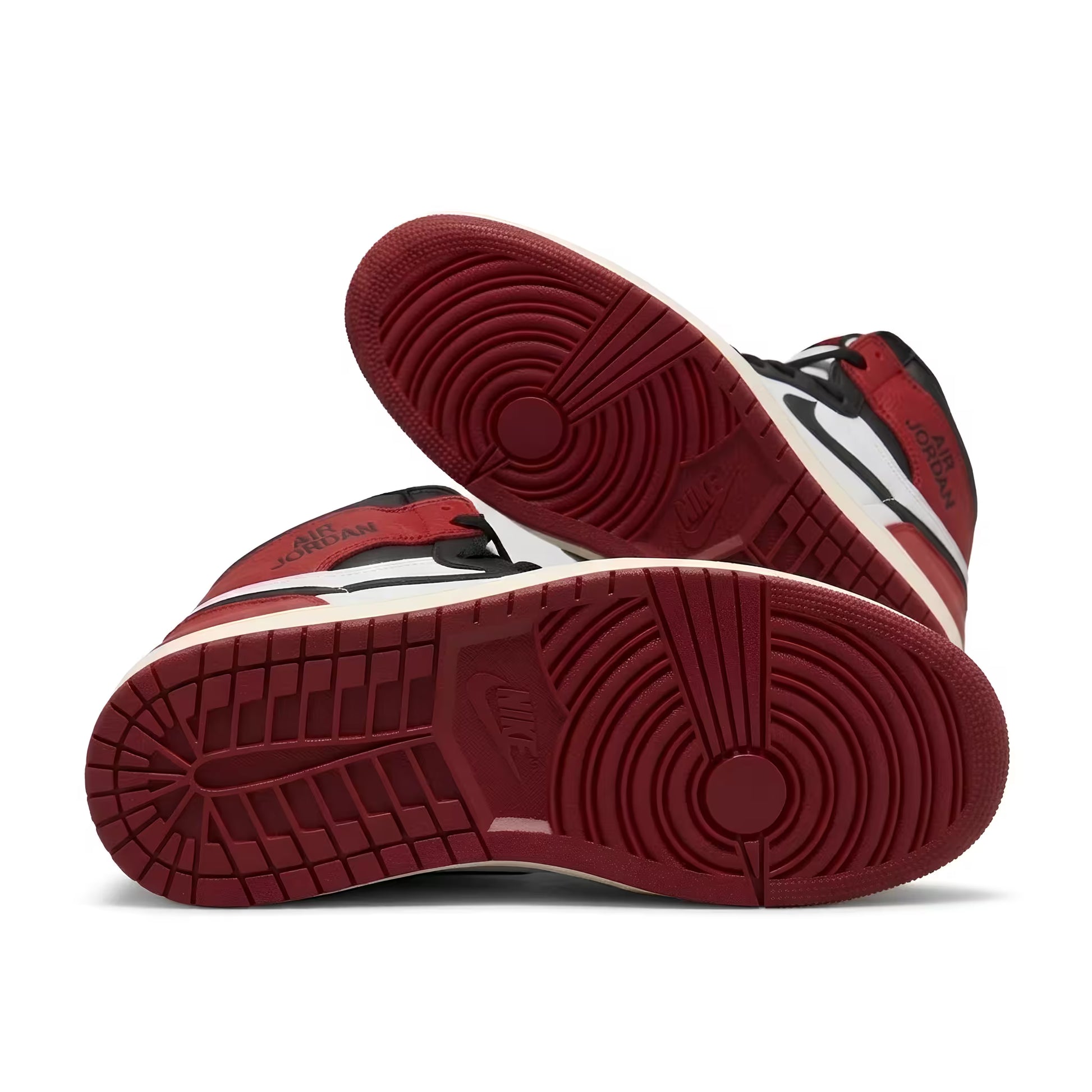 Red and black air jordan 1 sneaker with a white sole on a white background