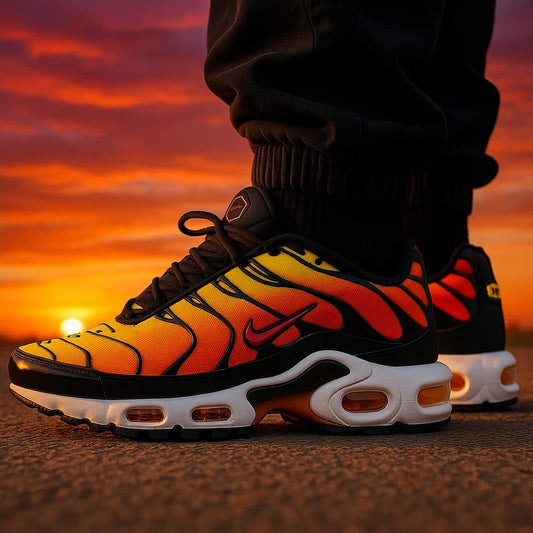 Nike Air Max TN shoes with a fiery design against a sunset sky