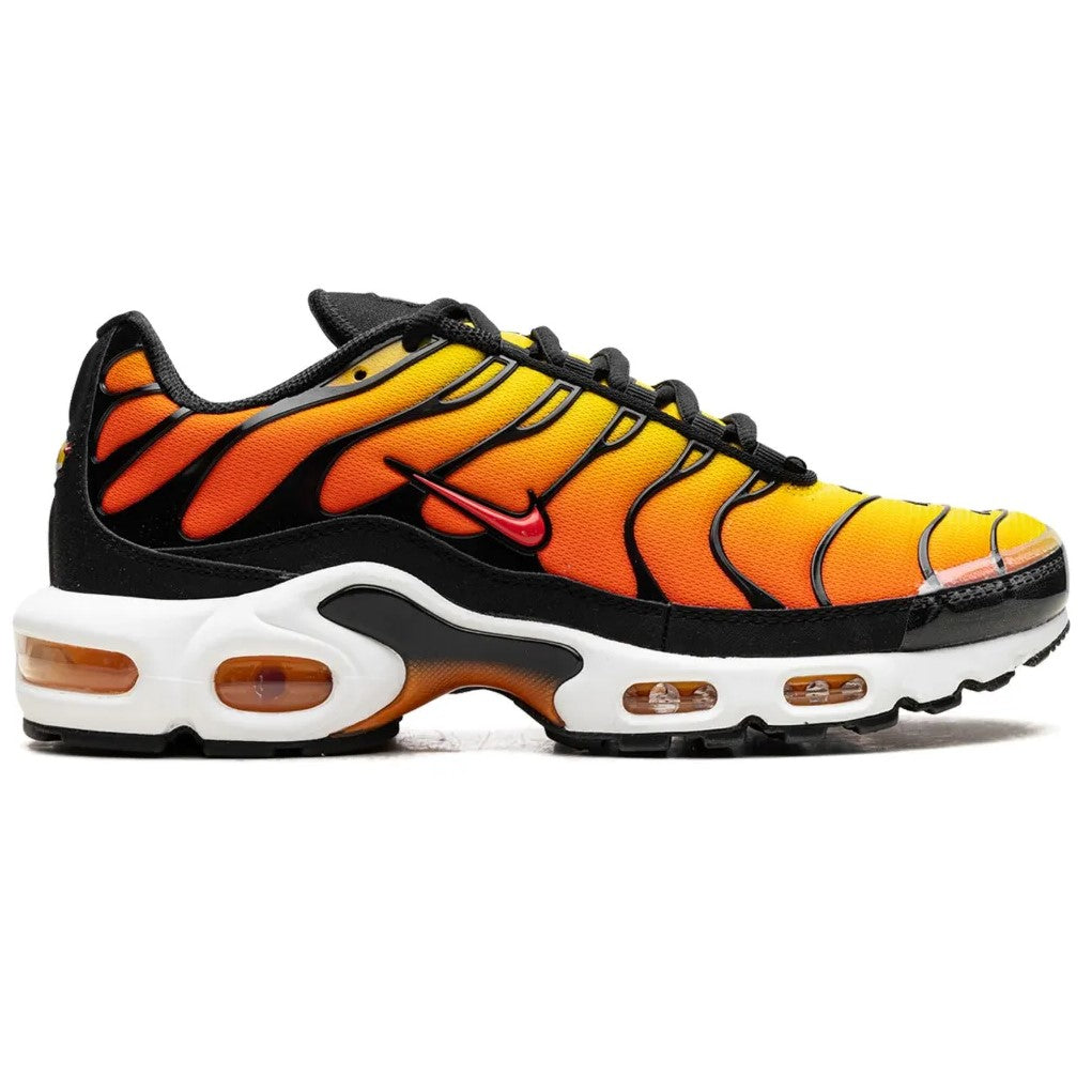 Sneaker with orange and black tiger stripe pattern on a white background