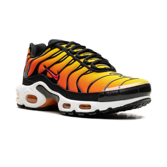 Sneaker with orange and black tiger stripe pattern on a white background
