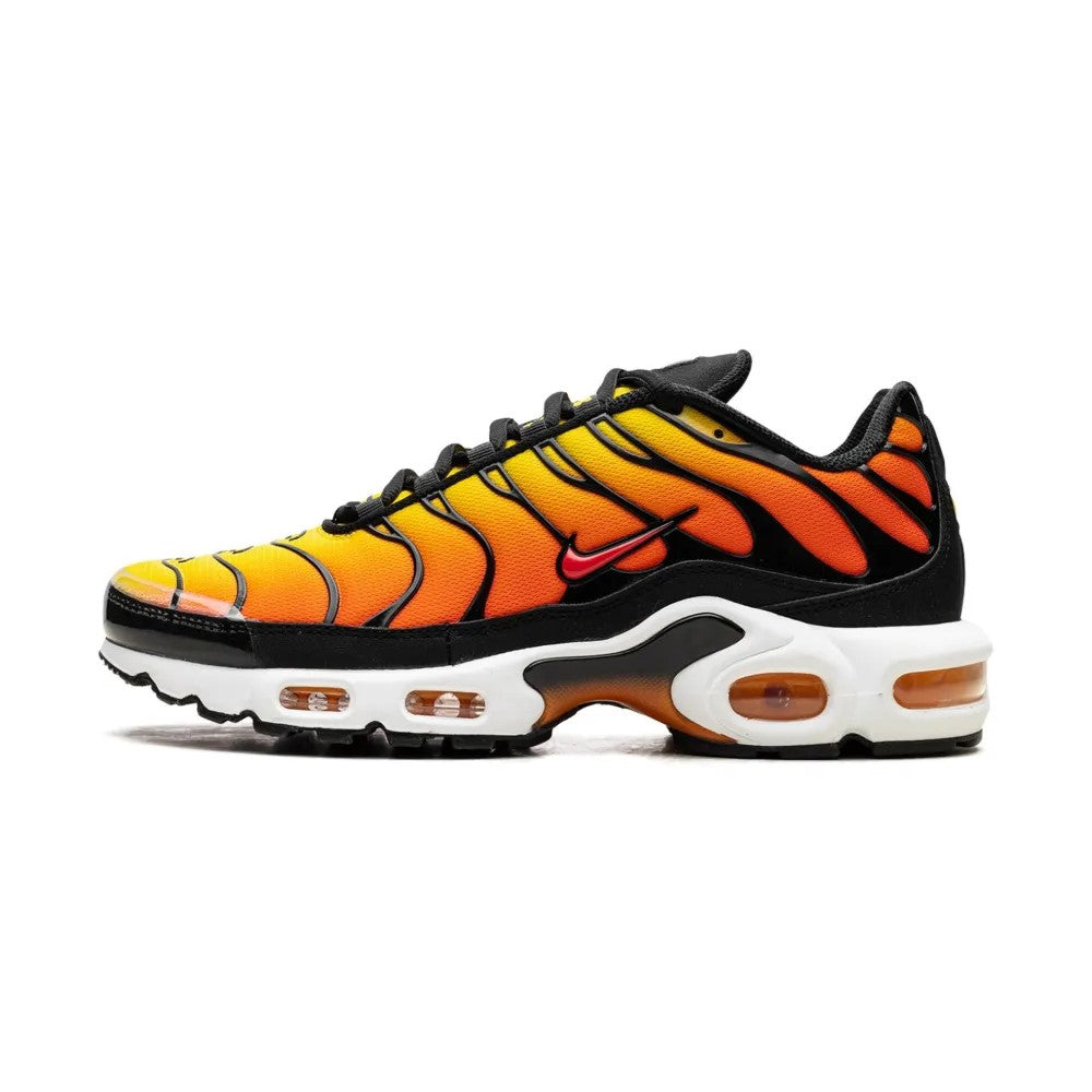 Orange and black sneaker with Nike logo on a white background