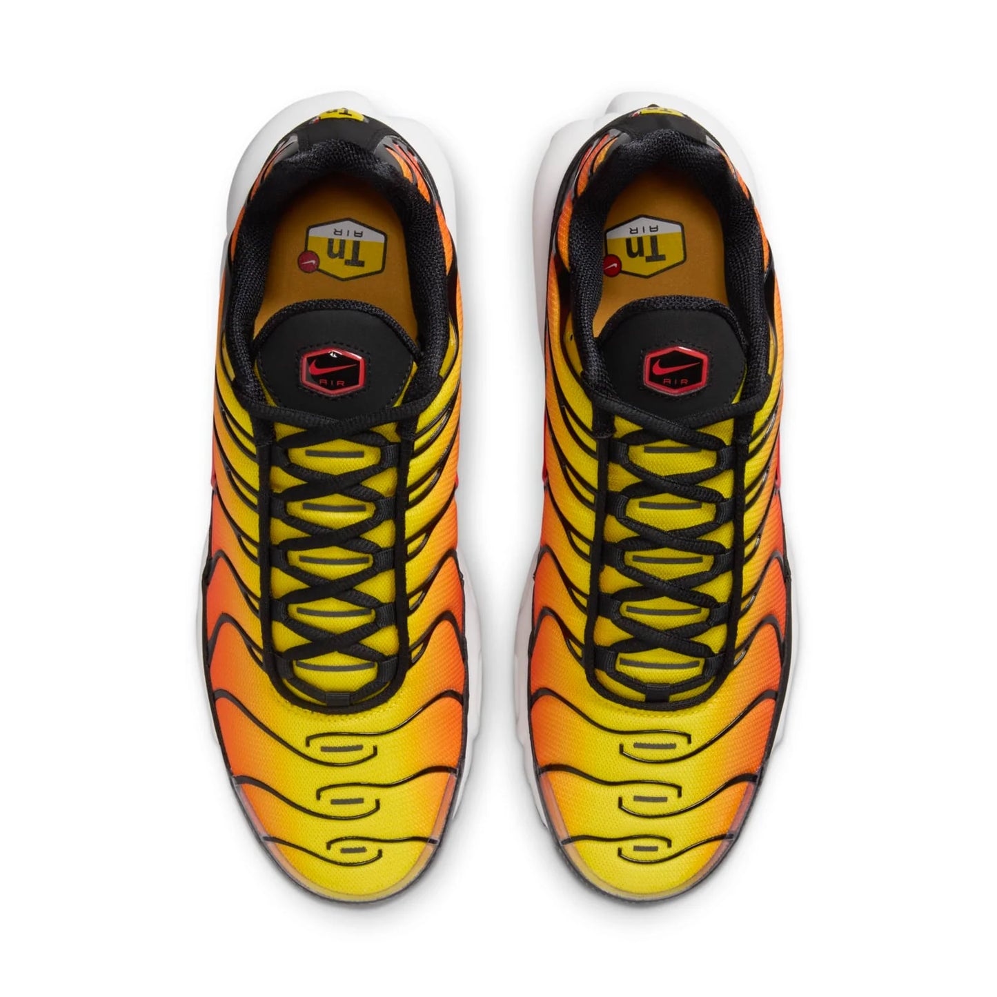 Pair of orange and yellow athletic shoes with black accents on a white background
