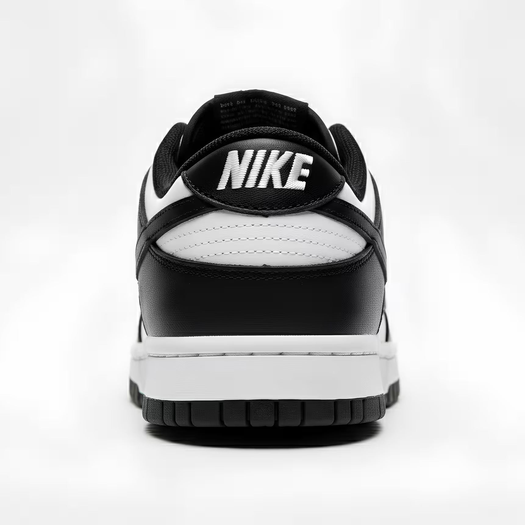 Black and white Nike sneaker on a light gray background