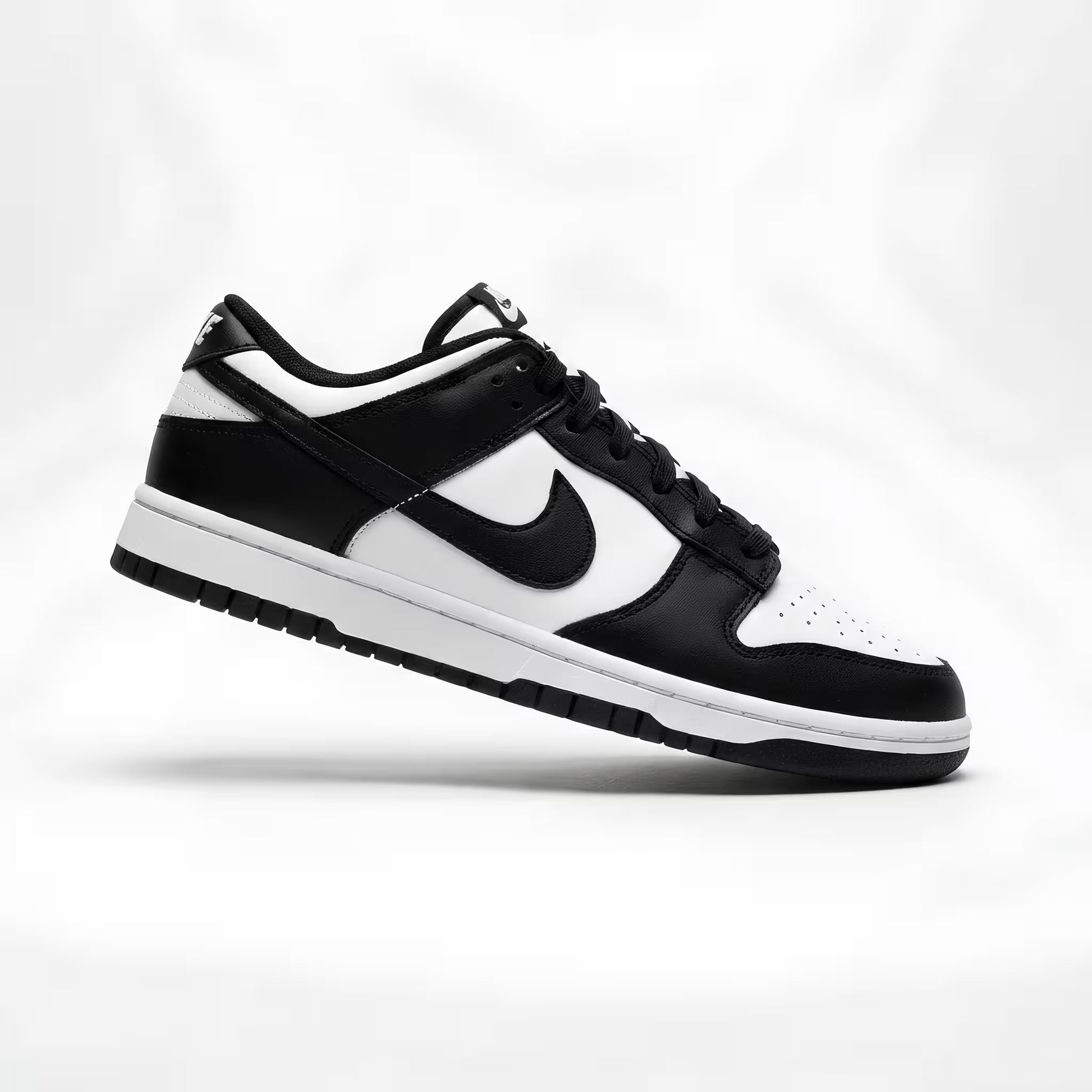 Black and white sneaker with Nike logo on a white background