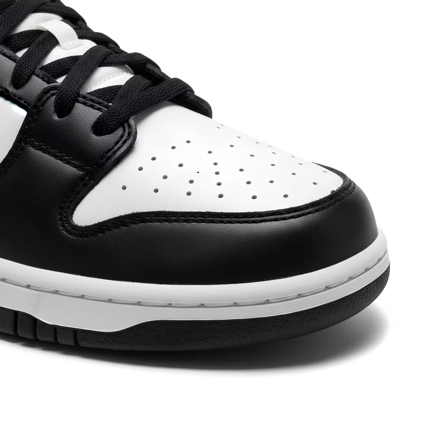 Close-up of a black and white sneaker on a white background