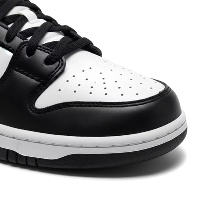 Close-up of a black and white sneaker on a white background