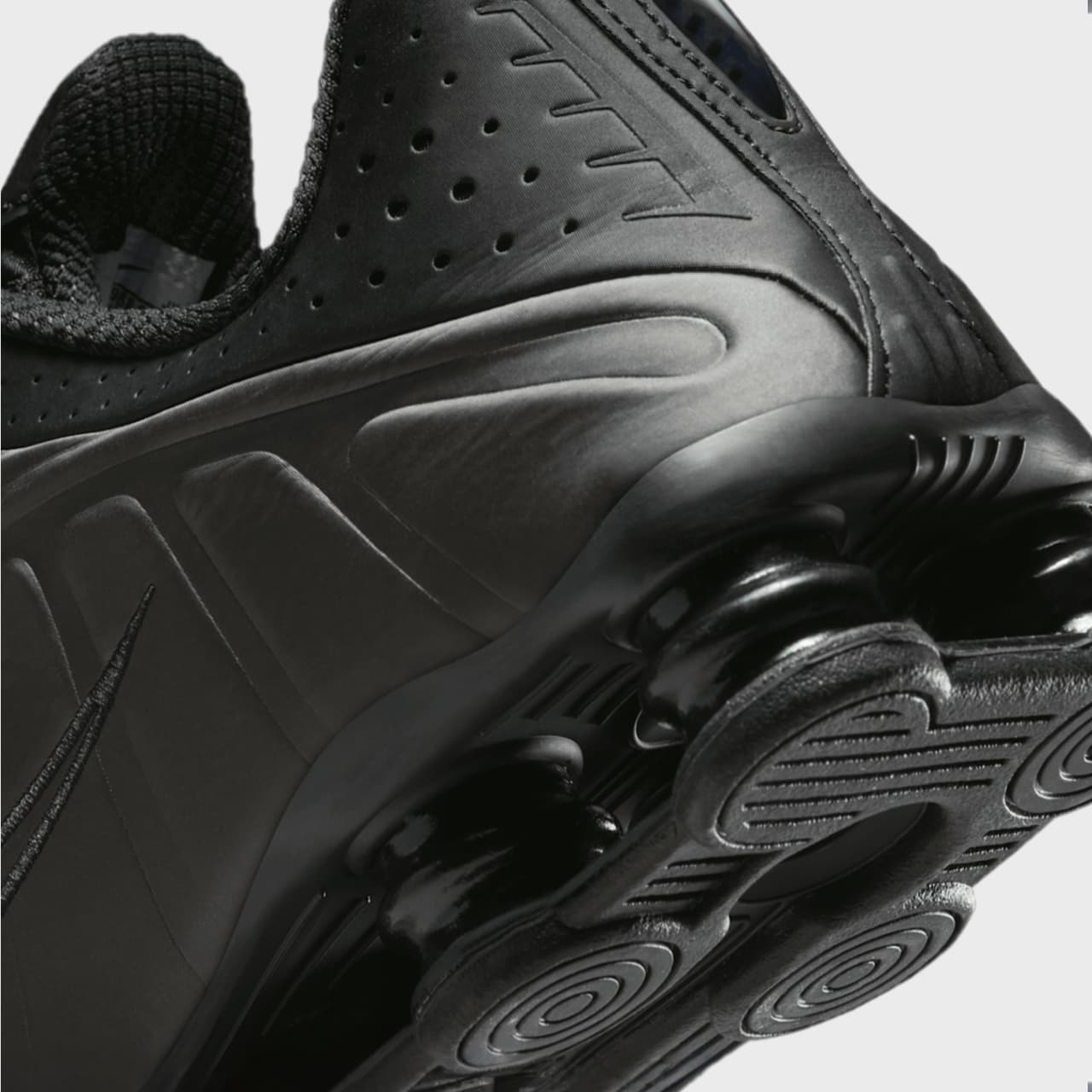 Close-up of a black athletic shoe with focus on sole design
