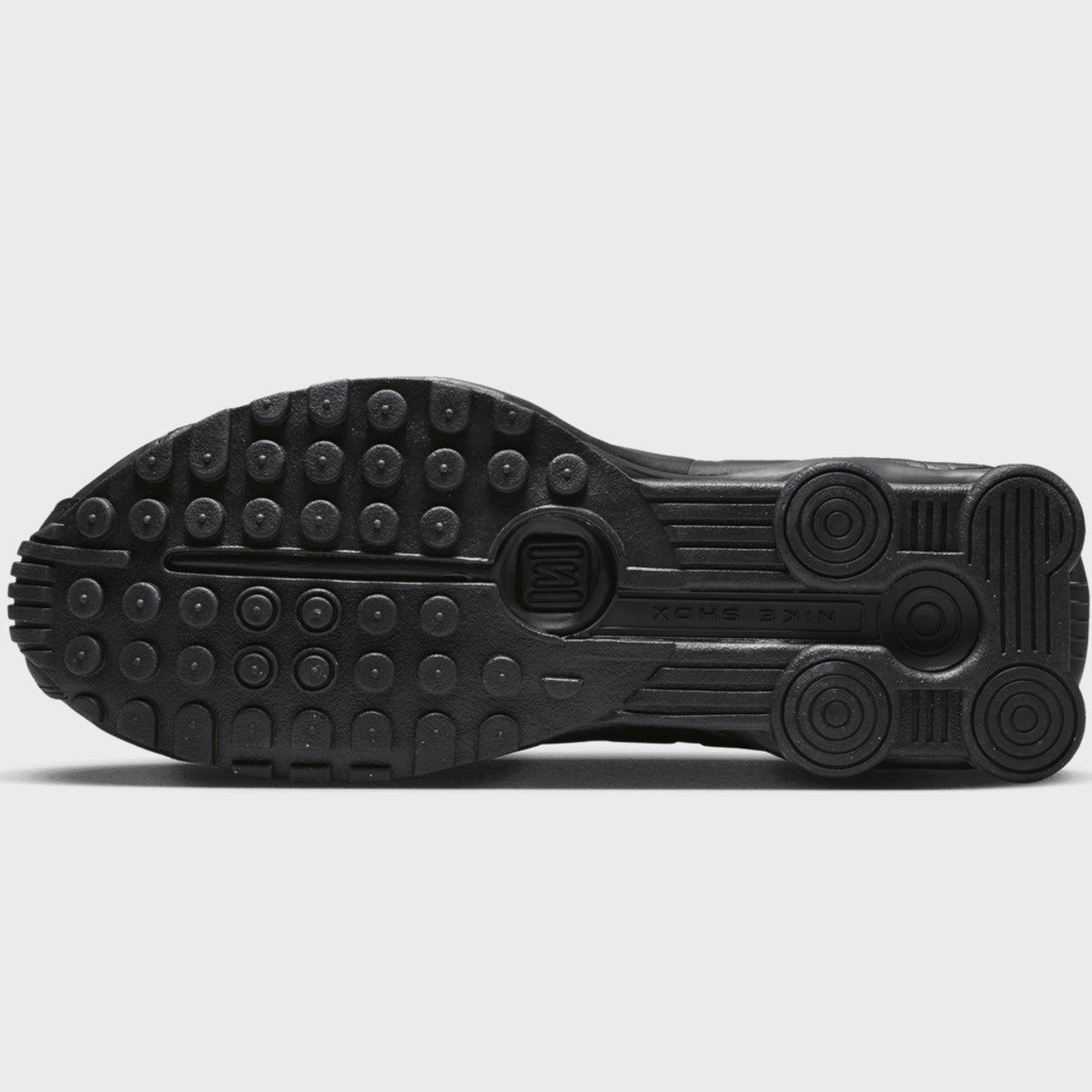 Black shoe sole with brand logo on a light gray background