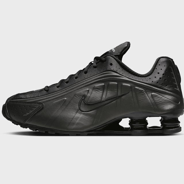 Black Nike Shox sneaker on a white background